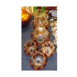 A collection of six graduated Murano style Glass Light Shades, each overlaid with Amber Glass swag