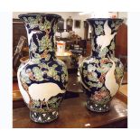 A pair of 20th Century European large baluster Vases decorated in the Oriental manner with flying