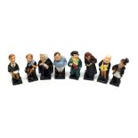 A Group of Royal Doulton Figures: Tiny Tim; Trotty Veck; Buzfuz; Tony Weller; Fagin; Oliver Twist;