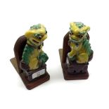 A pair of 20th Century Chinese Book Ends, applied with temple dogs and decorated in colours, 7”