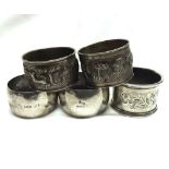 A group of three various hallmarked Silver Serviette Rings; together with two Indian White Metal