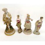 A group of four late 19th/early 20th Century Continental Figures, decorated throughout in colours,