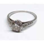 Platinum Brilliant Cut Solitaire Diamond Ring with small Brilliant Cut Diamonds to the shoulders.