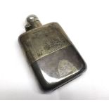 A George V Solid Silver Spirit Flask of curved rectangular shape with detachable beaker base,