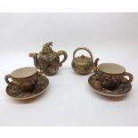 A Satsuma part Tea Service, the small Teapot, handle and spout formed as dragons head and tail