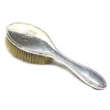 An Edward VII oval Silver backed Dressing Table Brush, Chester 1910, 10” long