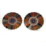 A pair of 19th Century Imari Circular Dishes with hipped rims, centres decorated with radiating