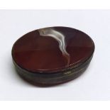 A Victorian Gilt Metal and Cornelian panelled Snuff Box, oval shaped, 2 ½” x 2”
