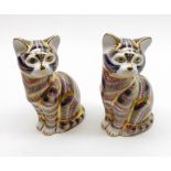 A pair of Royal Crown Derby Novelty Paperweights, modelled as seated tabby cats, complete with