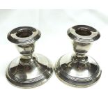 A pair of George VI Silver Mounted Dressing Table Candlesticks with loaded bases, banded reeded