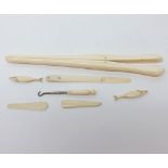 A Mixed Lot: a pair of Ivory Glove Stretchers, various small carved Ivory Models of Fish, etc