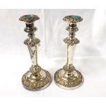 A Pair of 20th Century Silver Plated Candlesticks with tapering bodies to round circular loaded