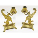 A pair of unusual 19th Century Brass Candlesticks, the stems formed as Mythological winged