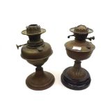 A Mixed Lot comprising: two Brass Oil Lamps, one with slag glass base, both lacking shades and