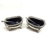 A pair of heavy gauge Elizabeth II Silver Salts, oval shaped with gadrooned rims, supported on