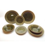 Collection of stoneware Studio pottery plates and bowls by Clive Davies comprising two 11 ½”