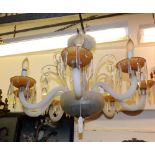 A large 20th Century eight branch centre ceiling Light Fitting, the arms with twisted opaque glass