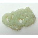 A Jade or Jadeite small Carving of a coiled Kaolin with a Pup on its tail, 2 ¾” long