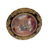 A hand painted Sevres Cabinet Plate decorated with an interior scene with a blue and gilt