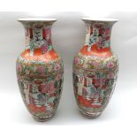 A pair of 20th Century Chinese Baluster Vases, decorated in Canton manner, with scenes of various