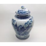 Chinese covered Baluster Vase decorated in underglaze blue with a Chinese river scene, (chips to rim