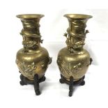 Pair of Chinese Brass Baluster Vases, the necks decorated with coiled dragons and the bodies also