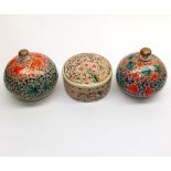 Collection of three Oriental small lacquered boxes, decorated with floral designs, various sizes,