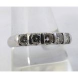 High grade precious metal half hoop ring set with five brilliant cut Diamonds, approximately > carat