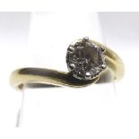 A precious metal ring set with a single Brilliant Cut Diamond of approximately < ct (marks unclear)