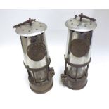 A pair of Vintage Miners Lamps, marked  Protector Lamp and Lighting Eccles , 9  high