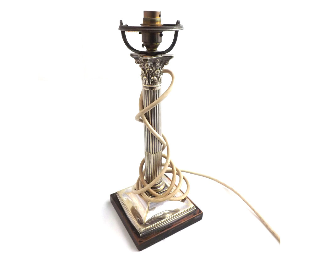 An early 20th Century Electroplated Corinthian Column Candlestick on ebonised base with fluted