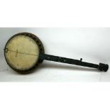 An early 20th Century five string Banjo, in need of restoration, length 36 approx