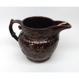 Antique brown-glazed jug decorated with continuous hunting scene fitted with a silver plated base