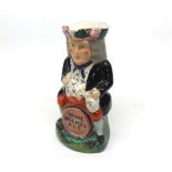 Staffordshire novelty Toby Jug, modelled as a portly figure astride a barrel, marked Home Brewed