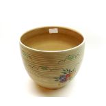 Clarice Cliff Newport Pottery jardinihre, ribbed body decorated with coloured floral sprays 7 =