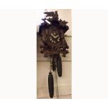 Late 20th Century Walnut Cuckoo Clock, the architectural case with applied bird foliate and game