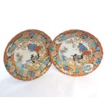A pair of Kutani Circular Plates, the centres painted in typical colour with exotic birds in a