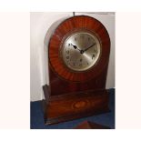 Mahogany Boxwood and Burr Walnut inlaid Mantel Clock, the arched case on a plinth base with two