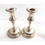 Pair of George V Silver Candlesticks of baluster form, raised on spreading circular loaded bases,