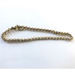 A hallmarked 9ct Gold Tennis (or line) all Diamond Set Bracelet, 20cm long