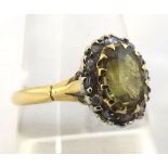 Yellow Metal centre oval yellow stone and small Diamond surround Cluster Ring, unmarked, repaired