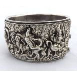 Siamese heavy white metal Bangle with two applied heavily carved panels depicting classical