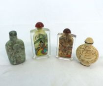 Two Oriental Glass Snuff Bottles, the cores of each decorated with scenes of ladies in gardens and