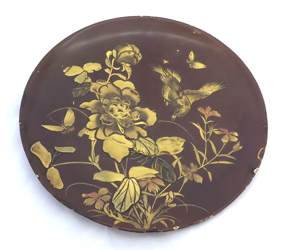 An unusual Oriental Circular Plate of metal construction, heavily overlaid/lacquered with exotic