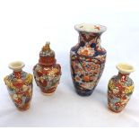 A Japanese Imari Baluster Vase, the neck moulded with Kaolin masks and the body decorated in the