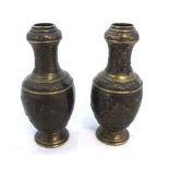 A pair of Chinese Bronze Patinated Brass Baluster Vases embossed with mounted warriors and foliage