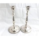 Pair of 20th Century Silver plated Candlesticks, baluster stems and spreading circular loaded bases,