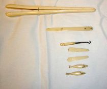 A Mixed Lot: a pair of Ivory Glove Stretchers, various small carved Ivory Models of Fish, etc