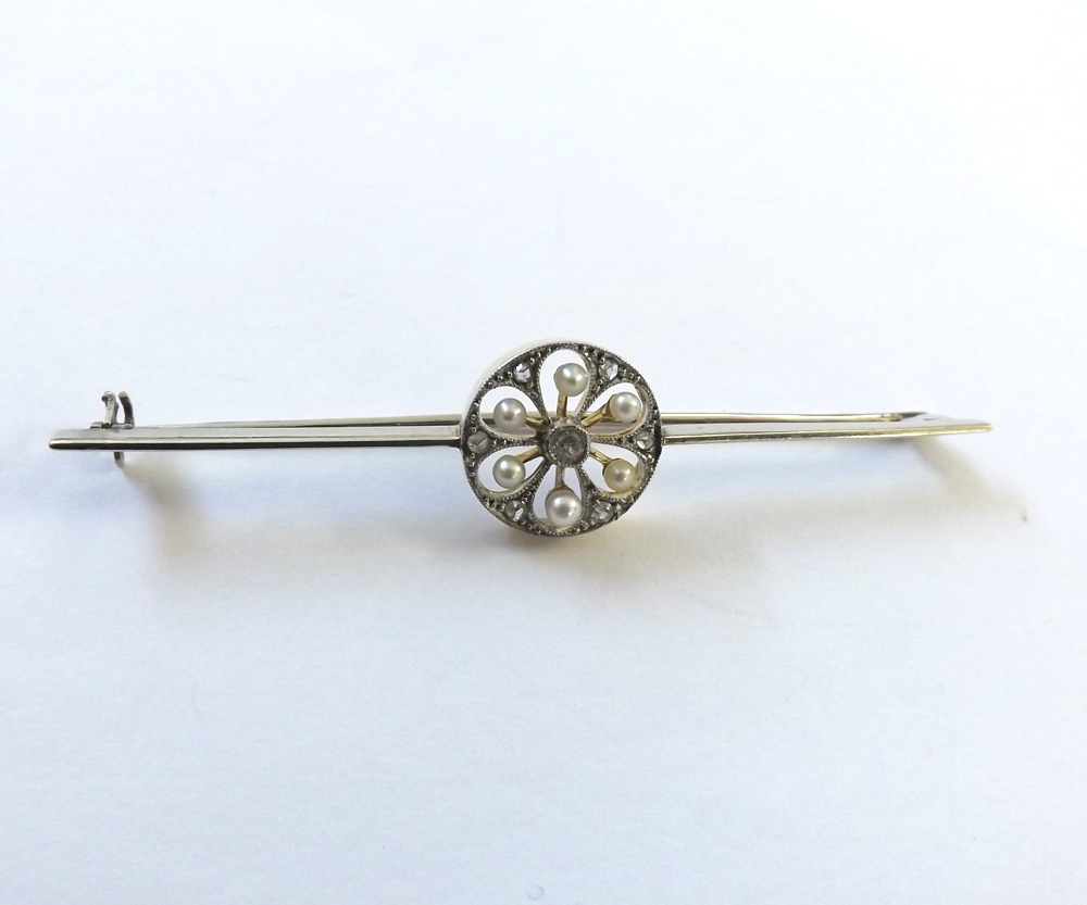 An Art Deco designed precious metal Bar Brooch, a centre circular panel pierced and set with six - Image 2 of 2