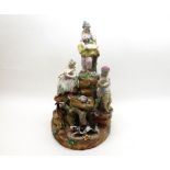19th Century Fontainebleau centre piece, modelled as four figures on a rocky outcrop with